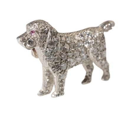 A DIAMOND SPANIEL BROOCH with pavÃ©-set diamonds and a single ruby eye, on unmarked white metal, 3.2cm, approx 11.5grams