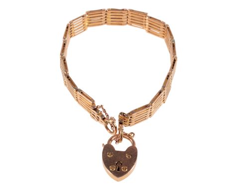 A  YELLOW GOLD GATE LINK BRACELET with padlock clasp stamped "15", approx 22.3grams