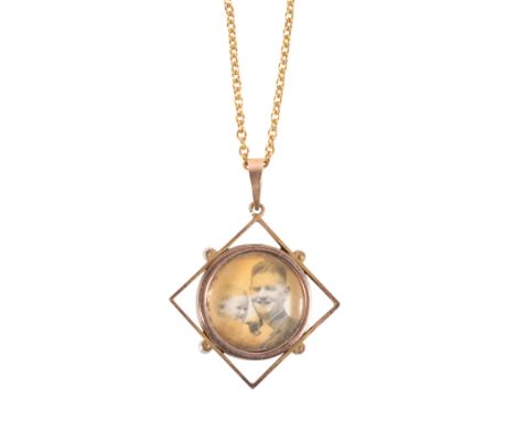 A GUILLOCHE ENAMEL AND SEED PEARL PENDANT / LOCKET the reverse with an open locket, held within an unmarked yellow metal fram
