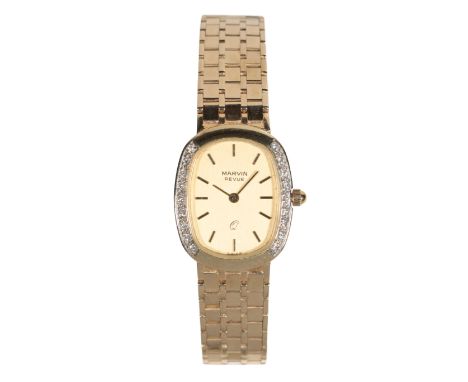 MARVIN: A 14CT GOLD LADY'S BRACELET WATCH with manual wind movement, the gold dial with gold baton numerals and hands, with d
