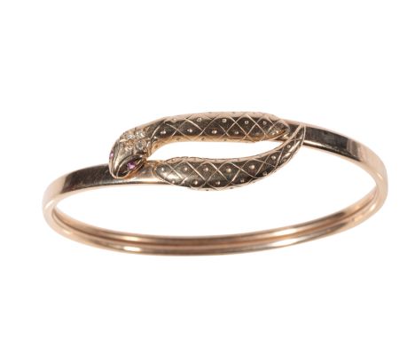 AN UNMARKED GOLD SERPENT BANGLE the head set with four brilliant-cut diamonds, and ruby set eyes, approx 10.3 grams total wei