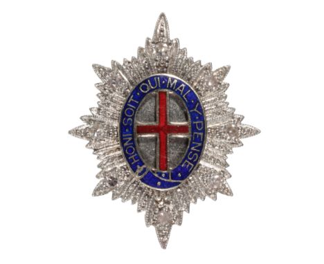 A DIAMOND AND ENAMEL REGIMENTAL BROOCH for the for the Coldstream Guards, the blue enamel inscribed " HONI SOIT MAL Y PENSE" 