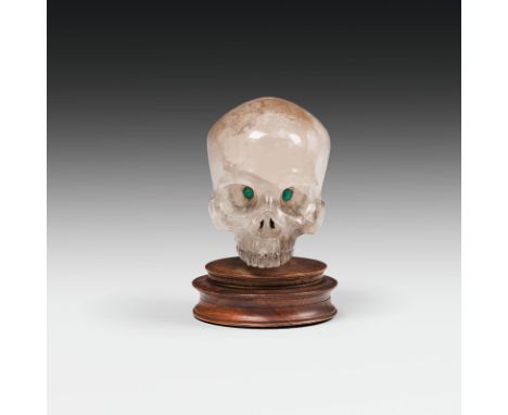  Bergkristall-Totenkopf, 19. Jh. Bergkristall; Glassteine später hinzugefügt, H. 13 cm     Rock crystal skull, 19th century r