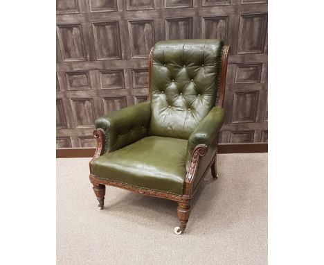 VICTORIAN MAHOGANY SCROLL BACK LIBRARY ARM CHAIR upholstered button back, arm rests and seat in green leather, on octagonal t