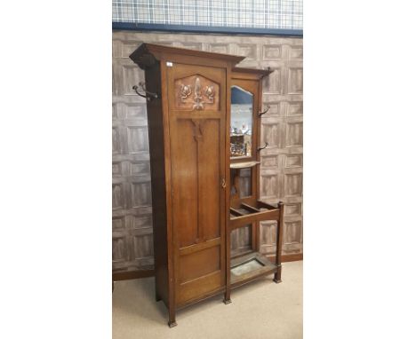 ARTS & CRAFTS GLASGOW SCHOOL OAK HALLSTANDthe left section with full length hanging cupboard, enclosed by a moulded panel doo