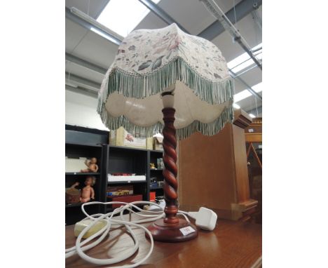 A wooden twist stem table lamp 