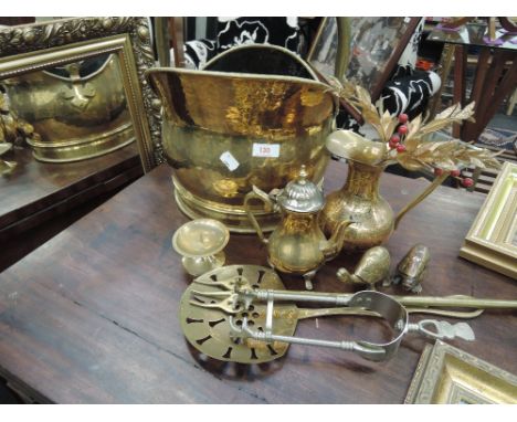 A selection of brassware including coal helmet , telescopic toasting fork etc