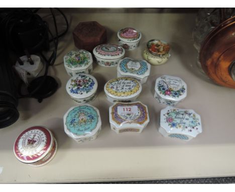 A collection of ceramic musical boxes and trinket boxes
