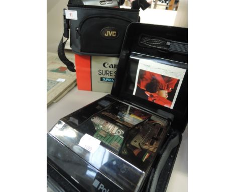 A selection of cameras including a JVC GR-D720EK digital video camera, a Cannon sure shot and a Polaroid Onyx