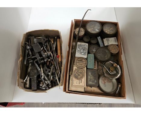 A collection of watch parts and various vintage watch tools 