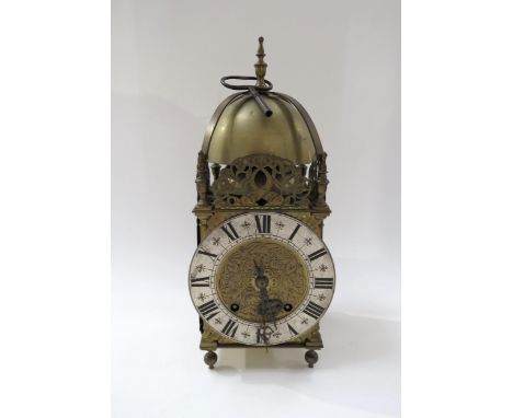 An early 20th Century brass lantern form striking clock with ting tang quaterly strike on two bells, with pendulum and key. 3