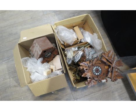 Two boxes of 20th Century cuckoo clock spares including cases, movements, pendulums, bellows etc 