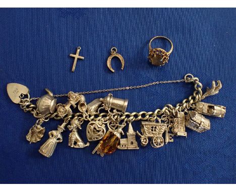 A 9CT GOLD DRESS RING AND A CHARM BRACELET with silver and unmarked white metal charms