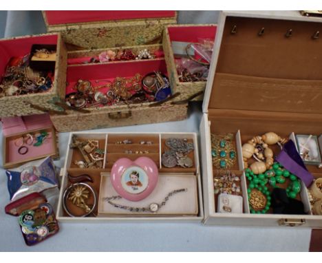 A COLLECTION OF COSTUME JEWELLERY badges, and a vintage Wade 'Tommy Steele' trinket box, contained in two jewellery boxes