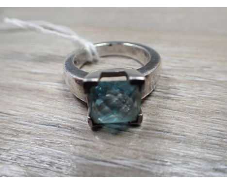 DINNY HALL: AN 'AQUAMARINE' DRESS RING the square-cut stone, claw-set on a silver shank, ring size P