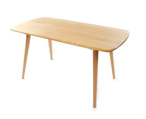 An Ercol blonde elm dining table, with a four plank top, raised on square tapering legs, 71cm high, 137cm wide, 70cm deep.