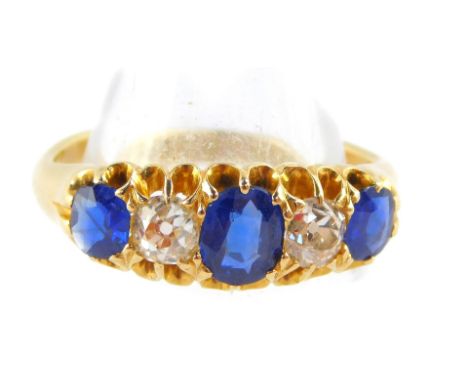 An Edward VII 18ct gold sapphire and diamond fire stone ring, diamonds approx ¼ of a carat, size L, 4.5g.