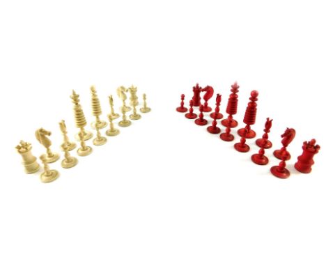 An Anglo Indian 19thC ivory chess set, white and red stained ivory, Queen 9cm high, King 10cm high.