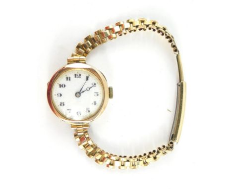 A Buren lady's 9ct gold circular cased wristwatch, white enamel dial bearing Arabic numerals, fifteen jewel movement, on a pl