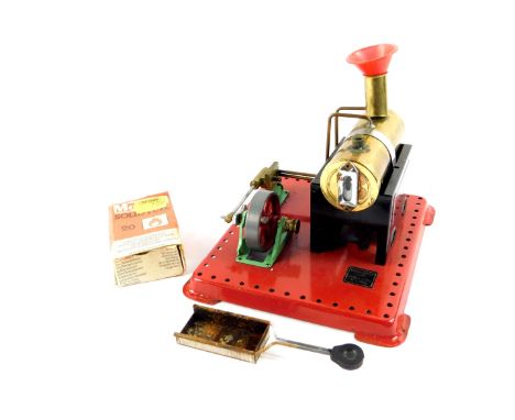 A Mamod steam engine, with solid fuel tablet box and funnel.