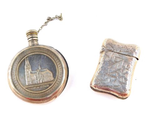 A Victorian silver vesta case, engraved with stylised leaves, banner reserve monogram engraved, Birmingham 1892, together wit