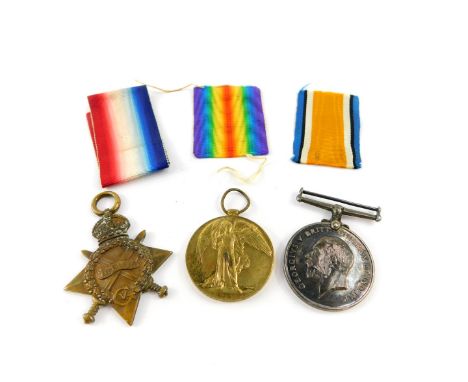 Three Great War medals, named to private Percy Judd, first Bn. Wiltshire Regiment, service no. 10574, comprising 1914/15 star