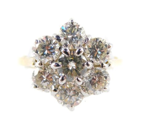 An 18ct gold and diamond seven stone flower head cluster ring, approx 2.0 carats in total, assessed colour H to I and clarity