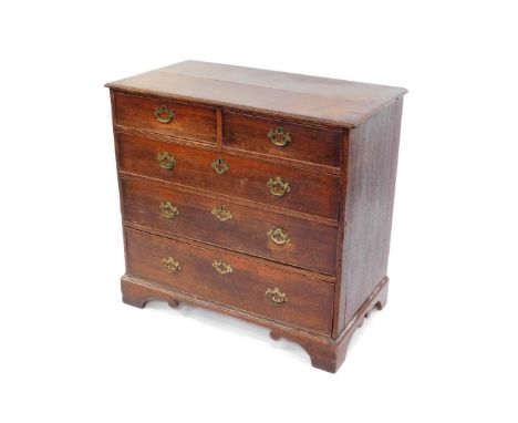 A George III oak chest, of two short over three long graduated drawers, raised on bracket feet, 90cm high, 96cm wide, 52cm de