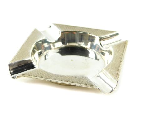 A silver ashtray with engine turned decoration, Viners Limited, Sheffield 1964, 2.48oz.