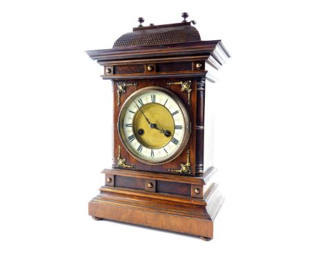 A German late 19thC oak and mahogany cased mantel clock, by the Hamburg American Clock Company, circular brass dial with enam
