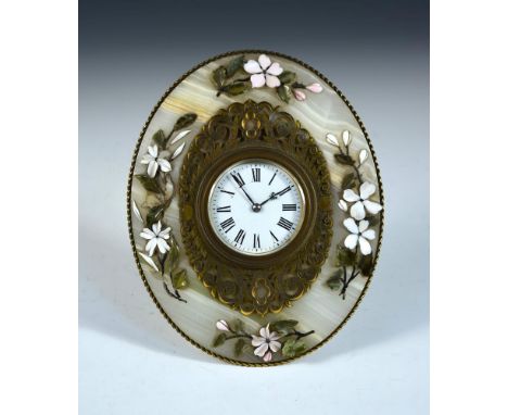 A late 19th century brass and agate strutt clock, retailed by Carlisle and Watts, Hanover Street, Edinburgh, the oval clock w