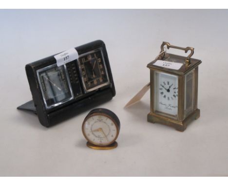 A miniature carriage clock retailed by Charles Frodsham and two Le Coultre travelling clocks (3)  