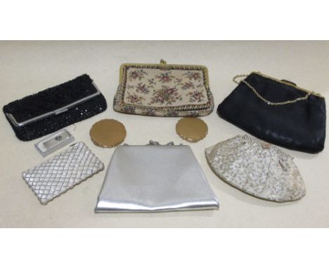 An enamel decorated gilt metal powder compact, another and five 1950's evening clutch bags (7)  