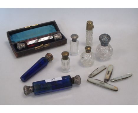 A 19th century ruby glass double ended scent bottle with sprung lid, together with a collection of seven other scent bottles,