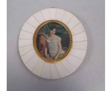 An oval French portrait miniature of a lady in a diaphonous gown, in gilt metal and bone frame  