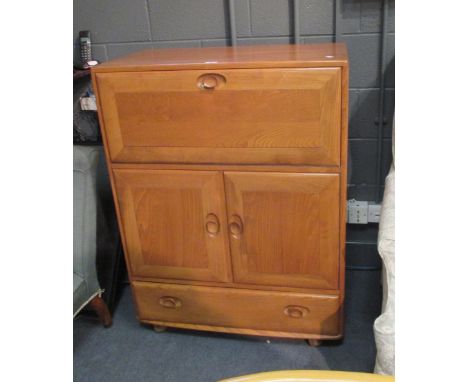 An Ercol elm drinks cabinet 111 x 83 x 45cm  