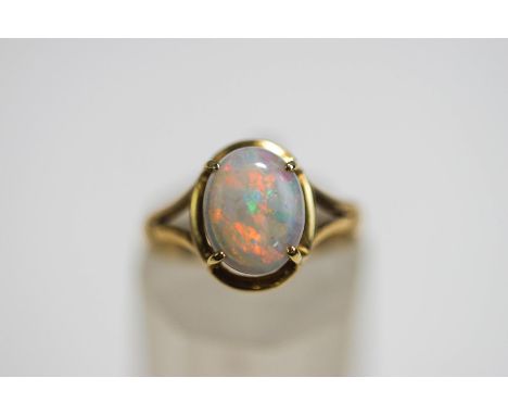 A single stone opal ring, stamped '9ct', finger size K, 2 g gross, cased