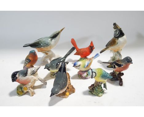 A collection of figures of birds, five Beswick, three Royal Worcester and two Karl Ens