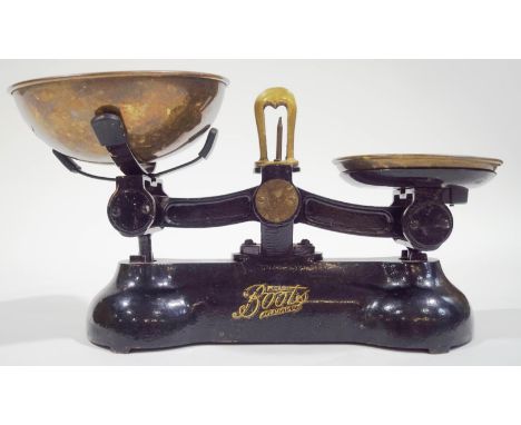 A set of brass and black enamel scales retailed by Boots