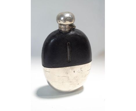 A large glass hip flask with half leather and half silver plate covering and hinged top, 18cm high