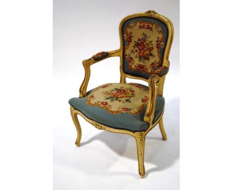 A Louis XVI style painted bedroom chair, with blue tapestry upholstery