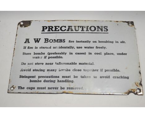 A WWII enamel 'Precautions' sign, for A W Bombs, 20.5cm x 30.5cm