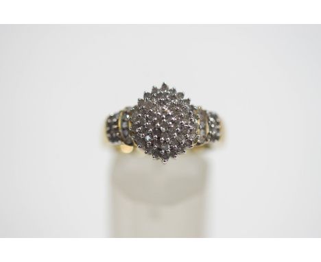 A 9 carat gold diamond cluster ring, set with seventy eight single cuts, finger size P, 4.8 g gross, cased