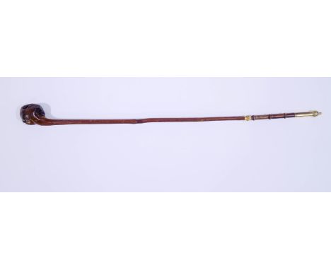 A carved wood Sunday walking stick