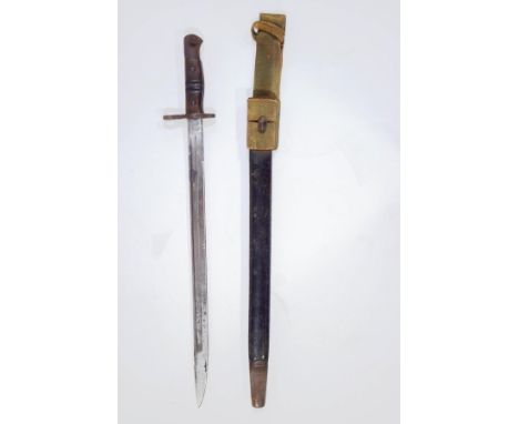 A 1913 pattern American Remington bayonet, in metal scabbard with canvas webbing loop, blade 43cm long
