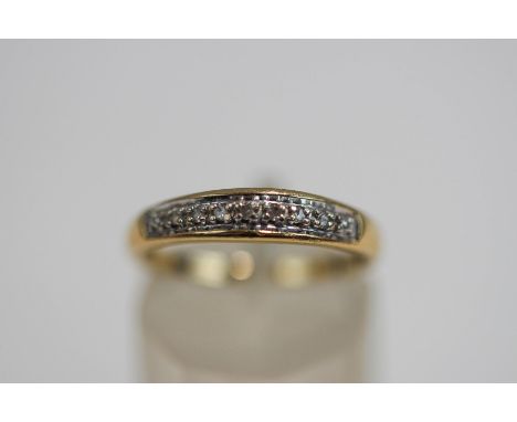 A 9 carat gold diamond half hoop ring, set with seven single cuts, finger size M1/2, 1.9 g gross