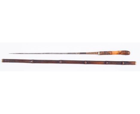 A 19th century German swordstick, the 43cm long blade stamped Solingen, in bamboo cane shaft with white metal mounts, open en