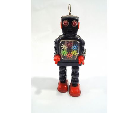 A mid 1960's Japanese clockwork tin plate robot, overall height 27cm high