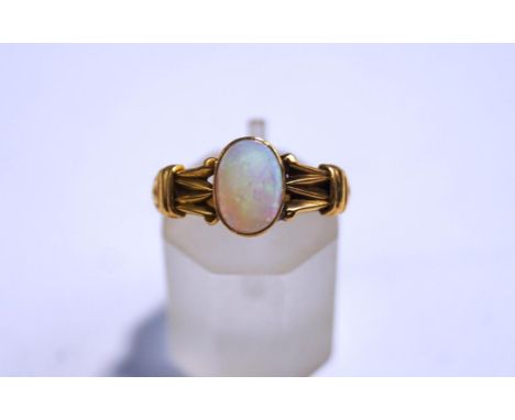 An 18ct gold opal ring, with partial hallmark, finger size N1/2, 2.7 g gross