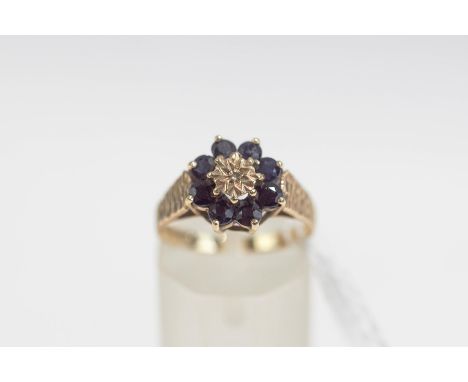 A 9 carat gold sapphire and diamond cluster ring, finger size M, 2.3 g gross